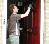 Leo painting the front door